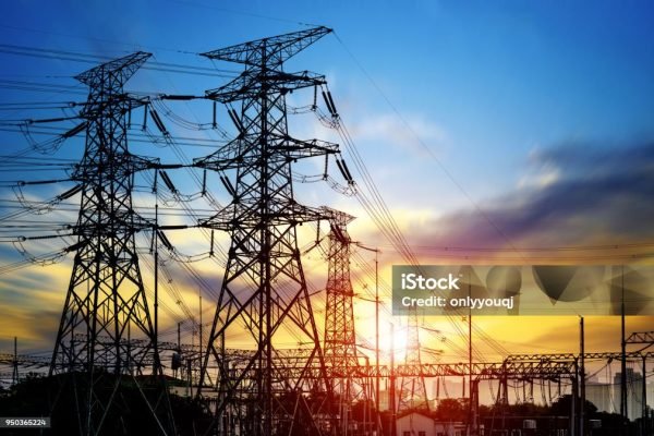 High pressure wire tower at sunset at dusk